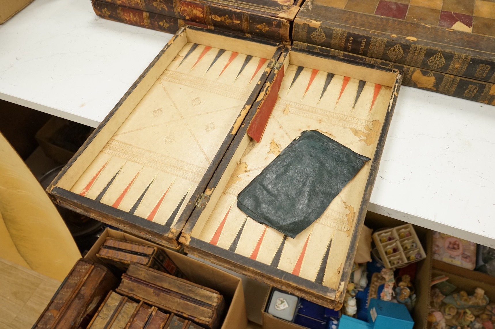 Three folding chess and backgammon boards in the form of books, 42cm